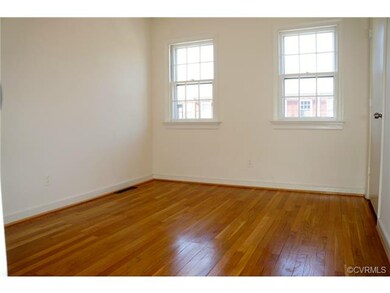 Front bedroom with large closet and hardwood floor