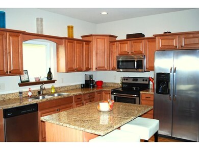 Very open kitchen. Hickory cabinets, granite count