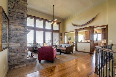 Soaring 14 ft ceilings, expansive stone fireplace,