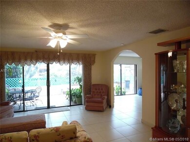 Living room with arched entry