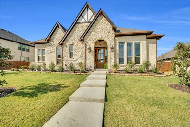 View of front facade with stone siding and brick siding