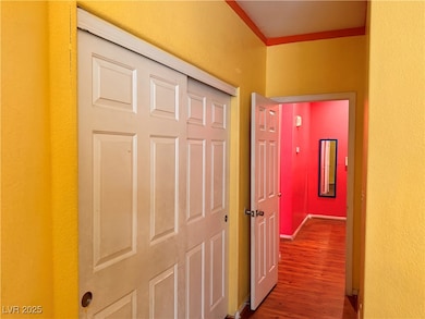 Hallway with wood finished floors and baseboards