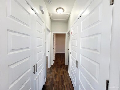 Hallway featuring dark hardwood / wood-style floors