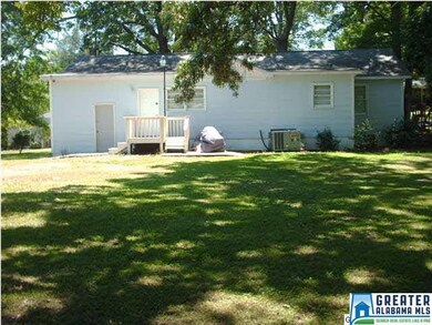 Rear of home with a nice deck and patio area.  The
