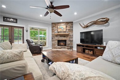 Living area with wood finished floors, french door