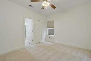 Unfurnished room featuring light colored carpet, 