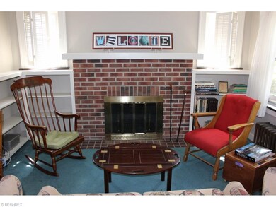 Terrific wood burning fireplace is flanked by buil