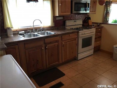 Kitchen. Kitchen w/ hickory cabinets & ceramic til