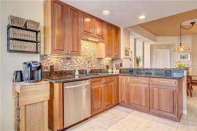 Kitchen featuring a breakfast bar and double sink.