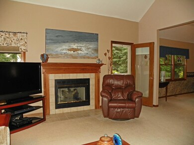 Gas log fireplace & door to Deck