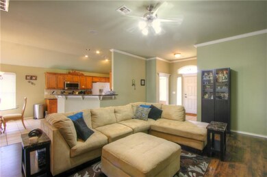 Living room looking back to the kitchen and front 