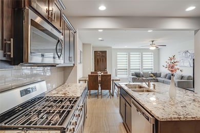 Kitchen with stainless steel appliances, a sink, 