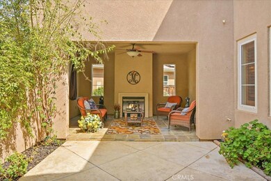 Courtyard Entry to your new home with a beautiful gas fireplace.