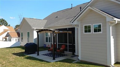 Beautiful fenced backyard with screened porch and 