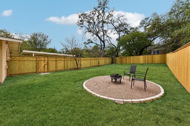 View of yard with a fenced backyard and an outdoo