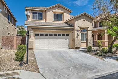 View of front facade featuring driveway, stucco si