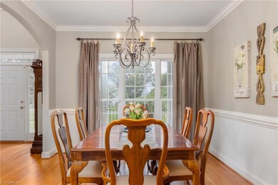 Dining room to the left when entering the home, has crown molding and a beautiful big window for natural lighting.