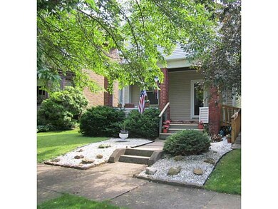Exterior Front. Tree-lined street in Vandergrift.
