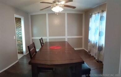FORMAL DINING OPENS TO KITCHEN.  COULD BE USED AS