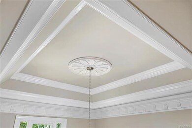 Coffered tray ceiling in foyer.