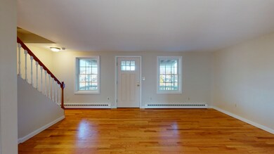 Unit A - living room with hardwood floor.