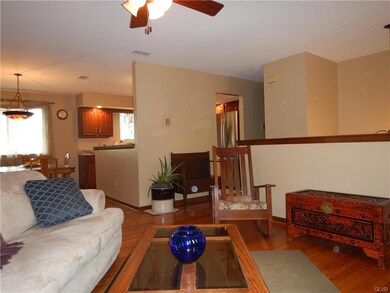 Living room view into dining room & kitchen