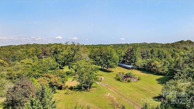 Former homestead offers mature trees and pasture.