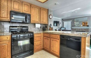 THE KITCHEN HOSTS GRANITE COUNTERTOPS, A BREAKFAST