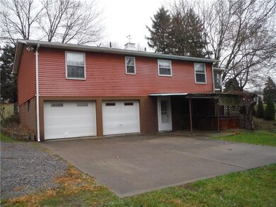 Rear View. Dual integral garages, walk out lower l