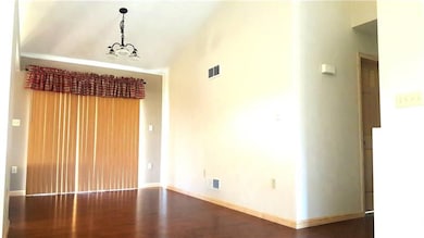Dining area sliding doors lead out onto a patio an