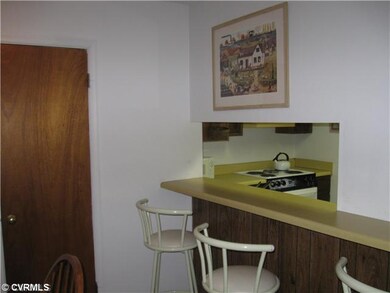 Kitchen - Convenient pass thru from the kitchen with a set at bar.