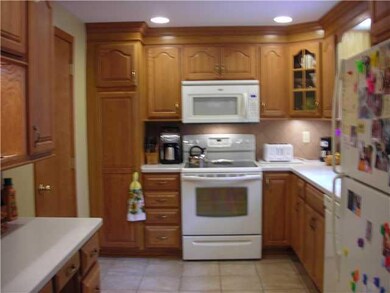Kitchen Newer oak kitchen with corian countertops 
