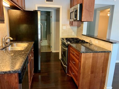 Kitchen featuring stainless steel appliances, dar
