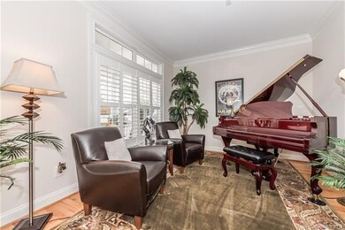 Formal living room with crown molding