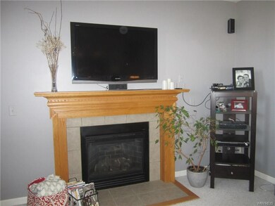 Close up views of Family Rm gas fireplace w/wood m
