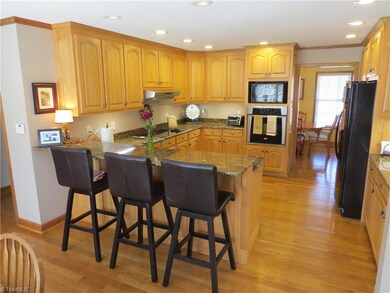 Additional view of kitchen with great bar area.
