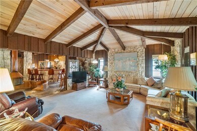 Carpeted living room with fireplace