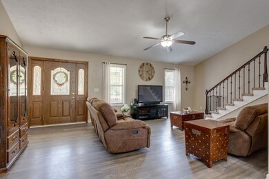 Doors and windows allow the sun to permeate this open space