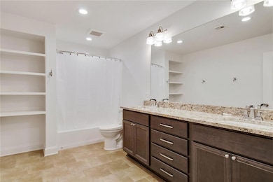 SPACIOUS PRIMARY BATHROOM WITH HIS AND HERS SINKS