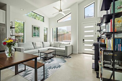 Living area with finished concrete flooring, a ce
