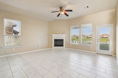 Spacious living room featuring a gaslog fireplace