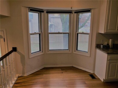 Eatin Kitchen with Hardwood Floors.