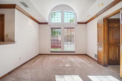 Dining Area featuring molding and textured ceiling