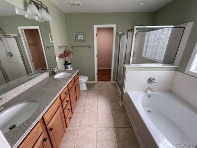 Full bathroom with tile flooring, dual vanity, sep