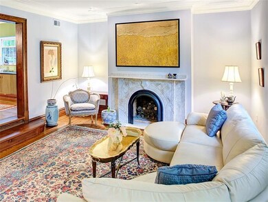 Huge sunny, sunken living room has high ceilings w