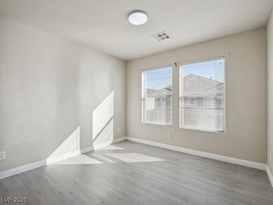 Empty room featuring wood finished floors and base