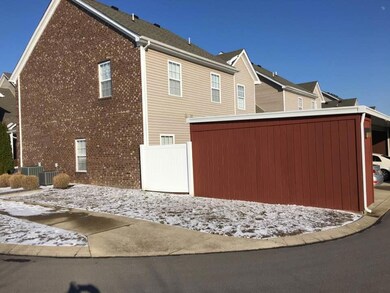 This is an end unit. Side view of home and two car carport.