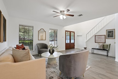 Living room with plenty of natural light, light w