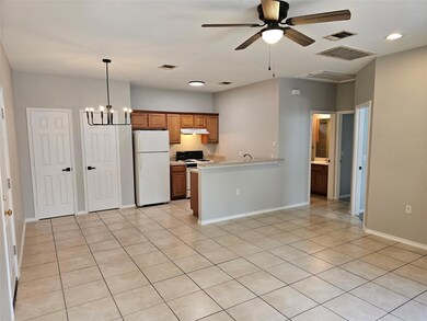 Kitchen with white appliances, under cabinet rang