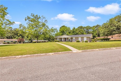 Ranch-style house with a front yard